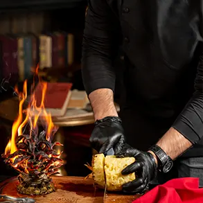 chef slicing pineapple